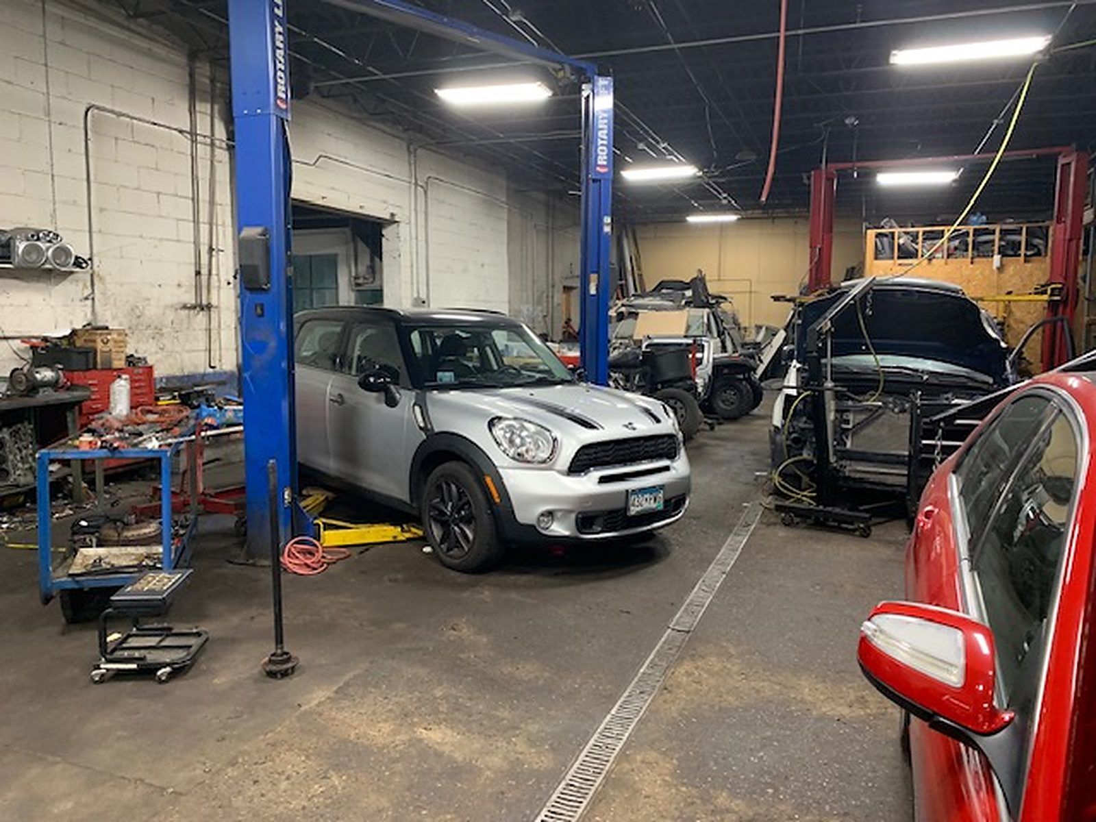 Inside NorthSide Garage’s Minneapolis workshop, with vehicles in the service bays